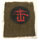 WWII style Royal Marine Comando Combined Ops patch on uniform fragment.