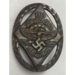 A German WWII style NSFK pinback badge.