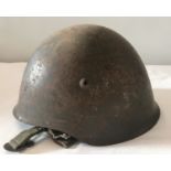 An M1940 - 63 Portuguese steel helmet, complete with canvas lining and chin strap.
