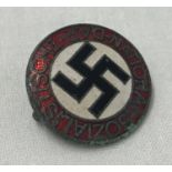 A German WWII style enamelled N.S.D.A.P pin back lapel badge.