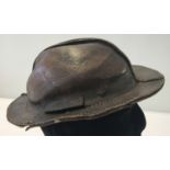 A circa 1900 Dutch leather miner's helmet.
