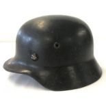 A Czechoslovakian Civil Defence steel helmet (NB re-used German M40 helmet).