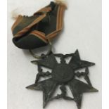 A WWII relic Condor Legion miniature medal.
