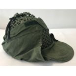 A 1937 pattern Swedish helmet with canvas and string peaked cover.