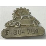 A WWII style Volkswagen factory worker's lapel ID badge.