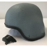 A Spanish Naval kevlar battle helmet, circa 1995, with padded lining and canvas chin strap.