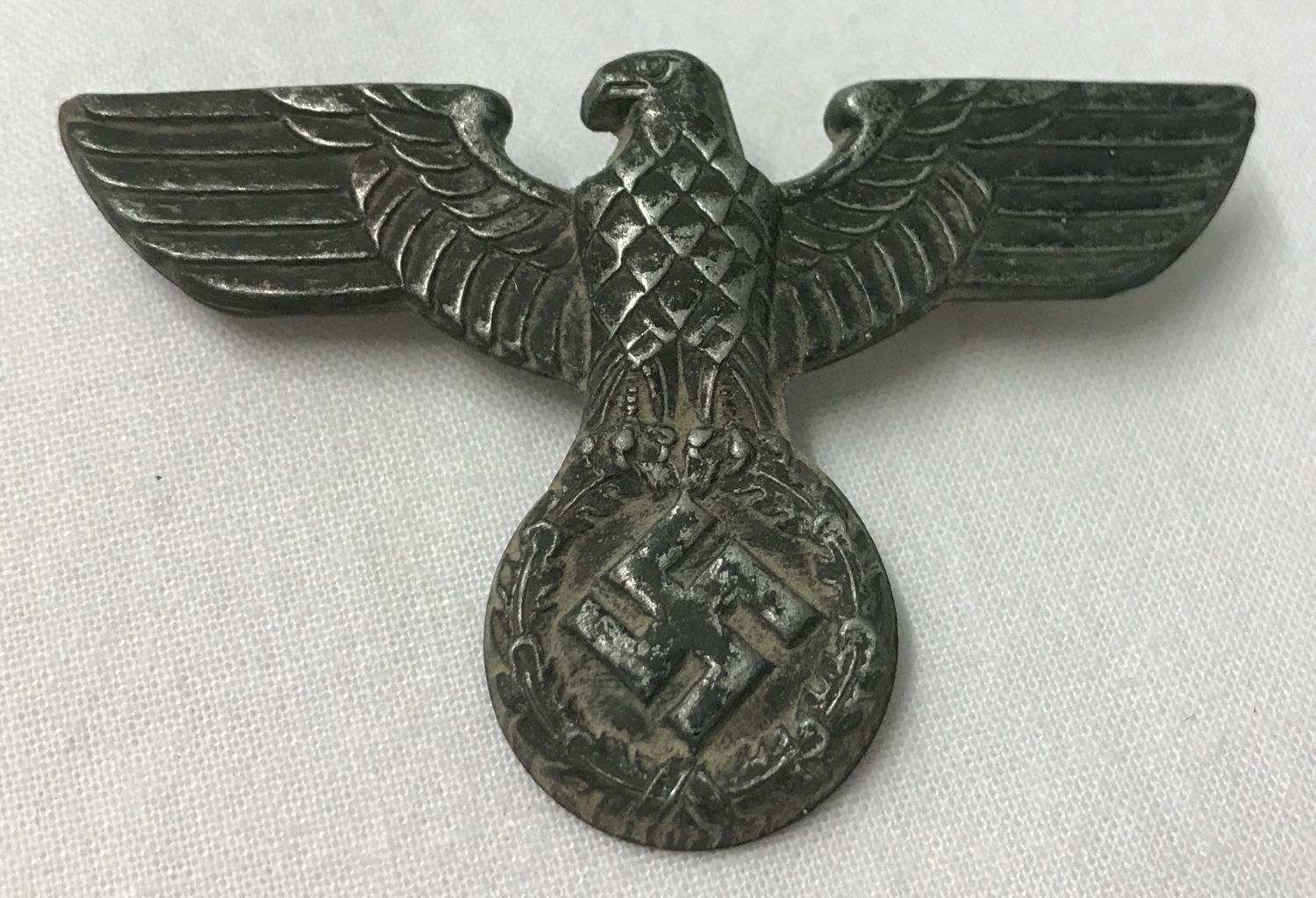 A German WWII style SA Kepi eagle badge with 2 slider fixings on reverse.