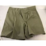 A Pair of officer's issue light khaki green shorts.