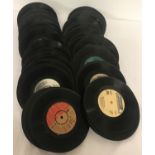 A quantity of vintage 7 inch singles by various artists, with out sleeves.