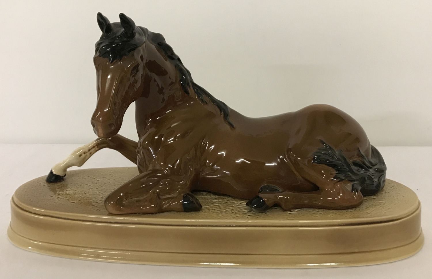 A Beswick ceramic horse figurine "Spirit of Peace" on ceramic plinth.