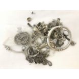 A quantity of broken scrap silver and white metal jewellery.