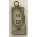 A silver ingot pendant hallmarked Sheffield 1978.