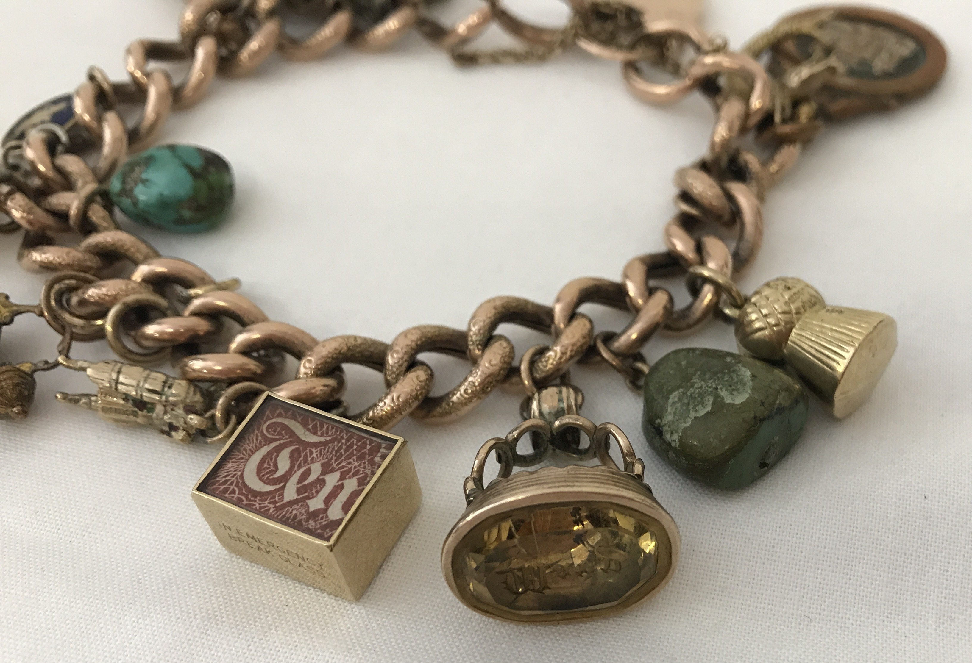 A vintage 9ct chunky rose gold charm bracelet with padlock and safety chain. - Image 4 of 5