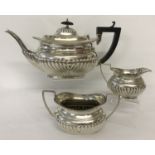 An Edwardian antique silver tea set with classic style decoration.