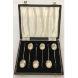 A case set of 6 silver coffee spoons with black coffee bean detail to handles.