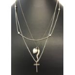 3 silver and white metal necklaces. Comprising : a box chain with bead decoration,