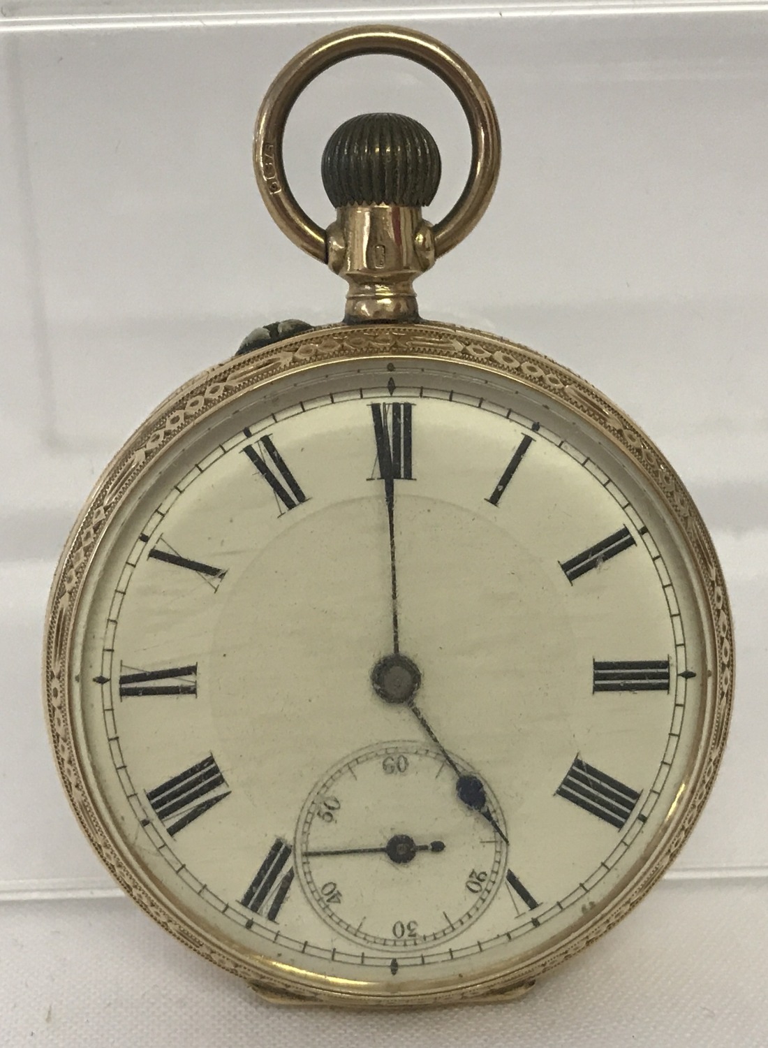 A ladies French 9ct gold case pocket watch. Full engraved decoration and empty cartouche to back.