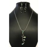 A modern style silver necklace and matching drop style earrings, set with paua shell.