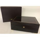 A new large boxed mahogany jewellery box by Walwood with inlaid detail to lid and brass bun feet.