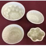 4 antique ceramic jelly/blancmange moulds, of varying sizes.