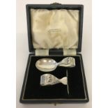 A vintage silver child's pusher and spoon with bear decoration to both. In original case.