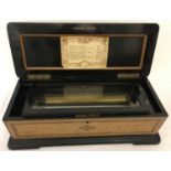 A late 19th century Swiss 8 Airs Musical box, housed in wooden case with inlaid banding & marquetry.