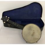 A vintage 1930's Jetelele cased Banjo ukulele.