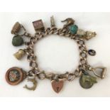 A vintage 9ct chunky rose gold charm bracelet with padlock and safety chain.