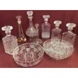 A box of assorted vintage glassware to include decanters and bowls.