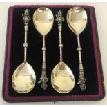 A set of 4 silver plated Punch and Judy serving spoons in original case.