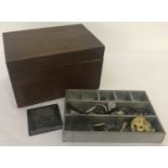 A vintage wooden box with E.A.G initials to top. Internal small compartment shelf containing watch