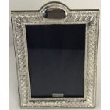 A 925 silver photo frame, hallmarked London 2018, with blank cartouche to top of frame.