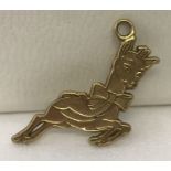 A gold pendant in the shape of the Babycham deer. Tests as 9ct gold.