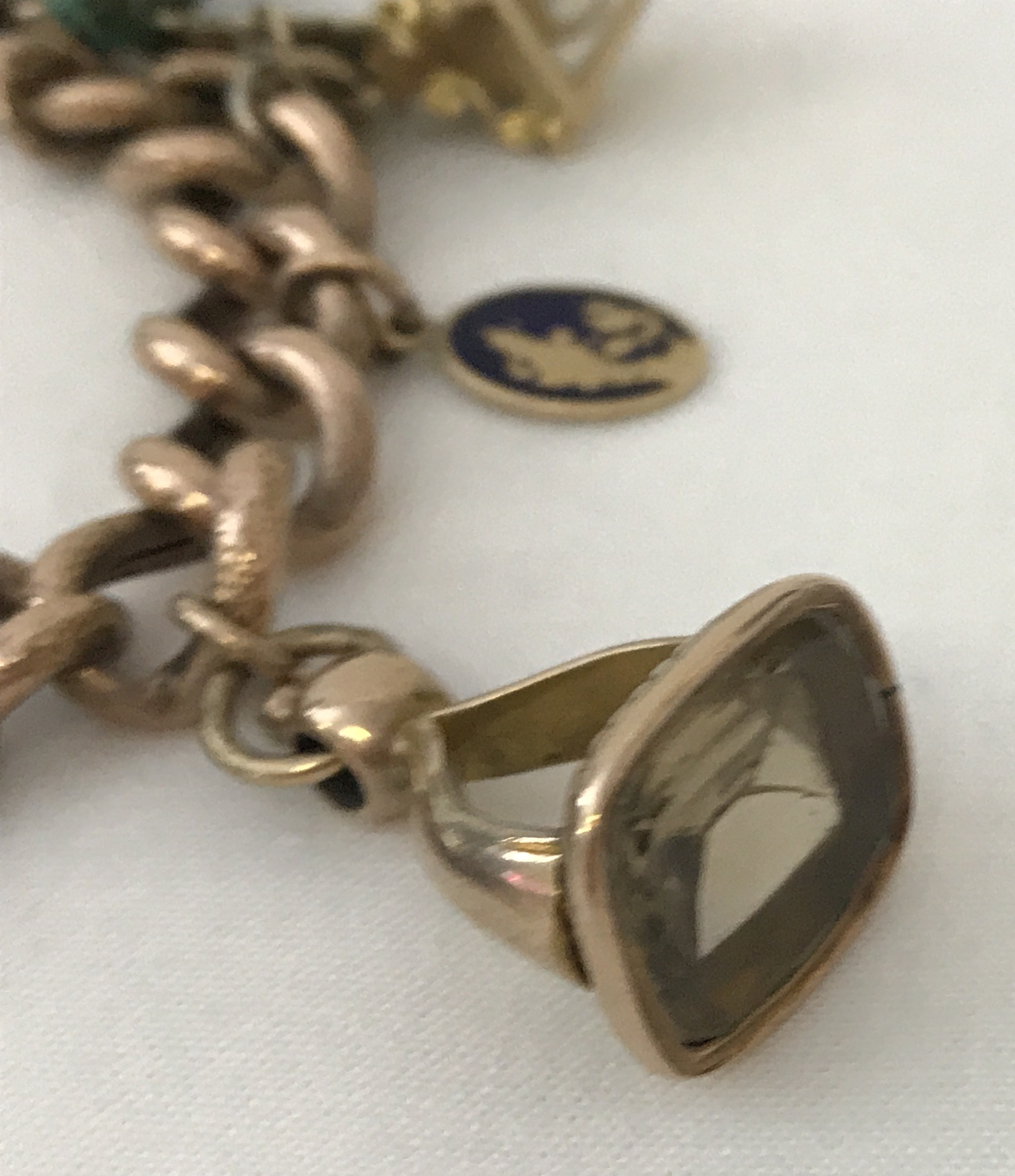 A vintage 9ct chunky rose gold charm bracelet with padlock and safety chain. - Image 2 of 5