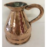 A Georgian copper half gallon haystack ale jug with leaded stamp and riveted hollow handle.