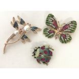 3 costume jewellery stone set and enamelled brooches in the shape of flying insects.