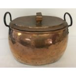 A large Victorian copper oval shaped 2 handled cooking pot with lid.