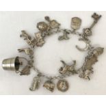 A vintage silver charm bracelet with 19 charms.