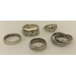 5 decorative silver band rings all marked 925.