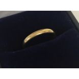 A 22ct gold wedding band. Size I. Approx. 2.3g.