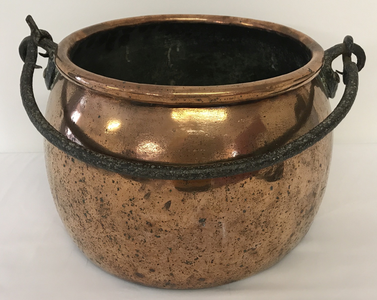 A large Victorian copper swing handled cooking cauldron.