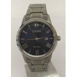 A men's Citizen Eco-Drive wristwatch with blue face and stainless steel bracelet strap.