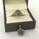 A 9ct gold dress ring and matching pendant, set with emeralds and diamonds.