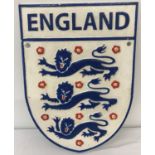 A painted cast iron wall hanging England Football club plaque.