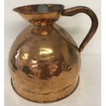 A Georgian copper 4 gallon ale jug of bulbous form, with leaded stamp and GR mark.