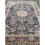 A large Oriental wool rug with fringed ends. Depicting lions, tigers, Persian cats, dragons deer and