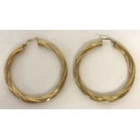 A large pair of 9ct gold twist style hoop earrings by Unoaerre. Fully hallmarked on hooks.