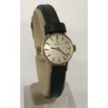 A 9ct gold case ladies Omega wristwatch with replacement black leather strap.