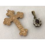 A vintage gold cross pendant with engraved detail to front. Bale needs attention.