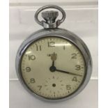 A chrome cased vintage pocket watch by Smiths with clear plastic front. In working order.